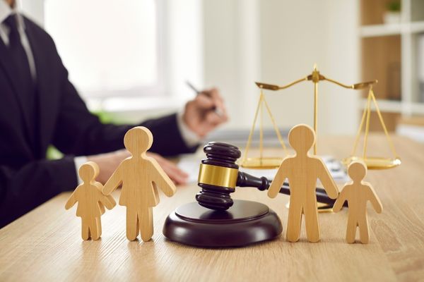 Parents signing estate documents for backup guardianship