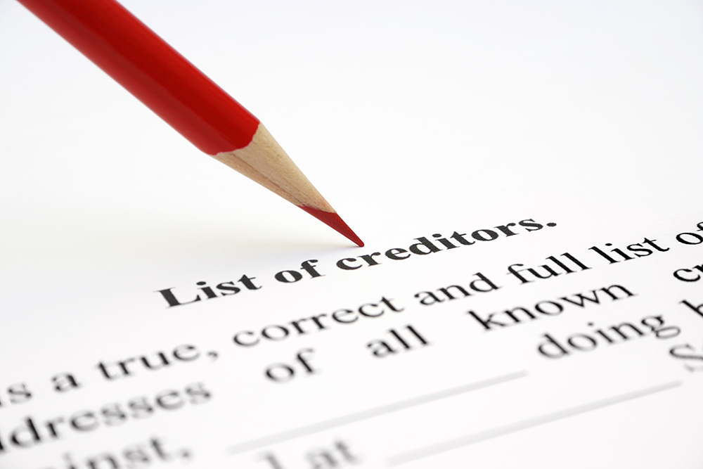 Florida probate creditor claim documents with bills and gavel on desk