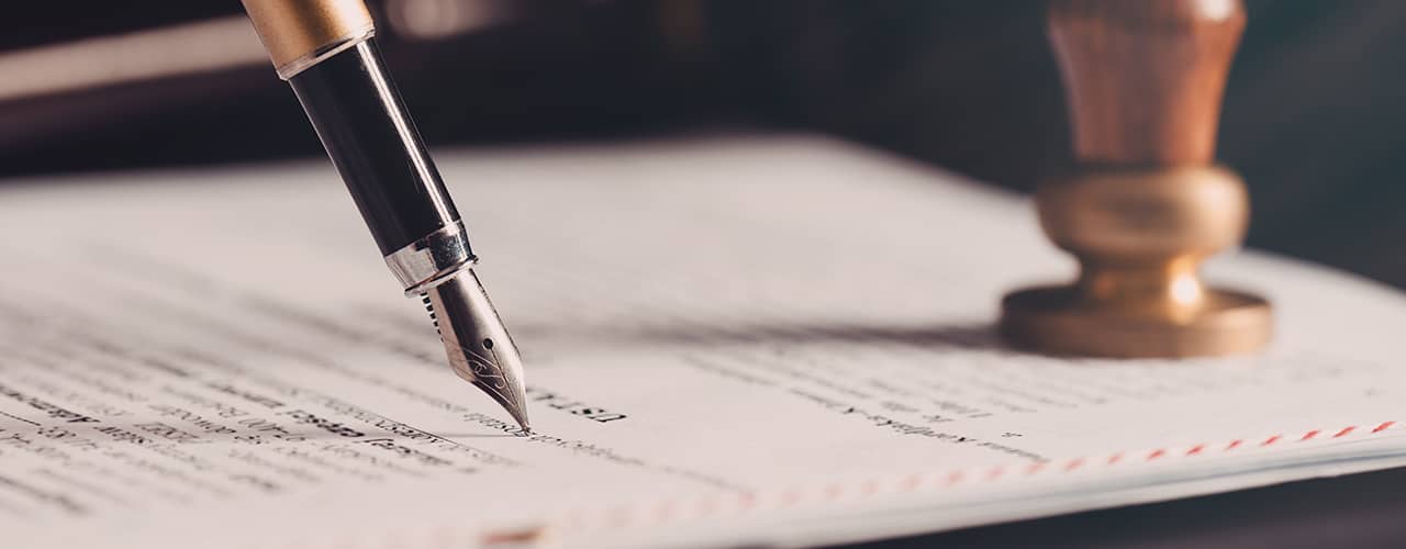 Florida will signing documents with pen and witnesses